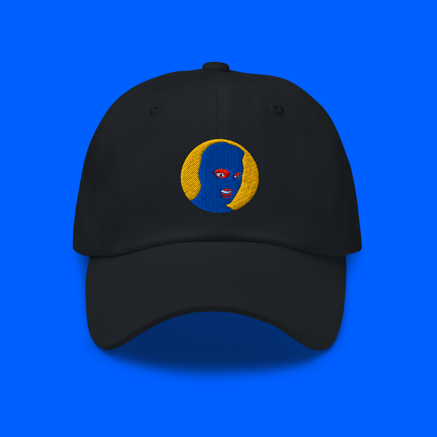 Black hat mockup for the Blue Moon Collection logo variant. Logo features a blue mask and yellow background.
