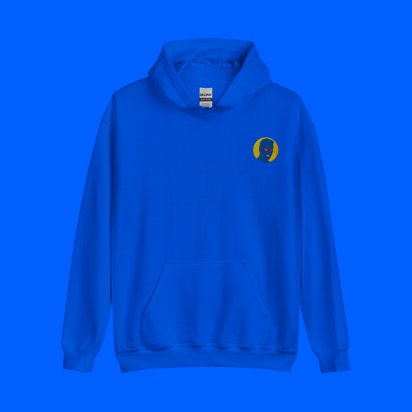 Royal blue hoodie mockup for the Blue Moon Collection logo variant. Logo features a blue mask and yellow background.