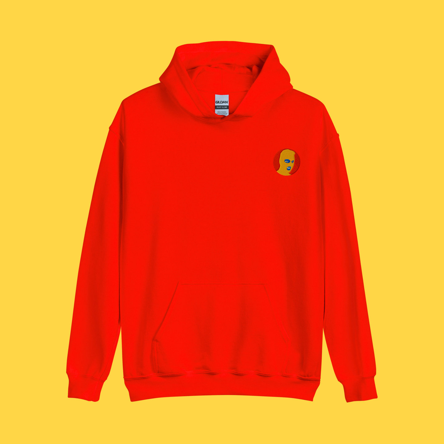 Red hoodie mockup for the OG Edition logo variant. Logo features a yellow mask and red background.